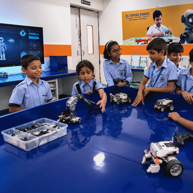 Students operating a robotic arm and robot cars in the AI and robotics lab