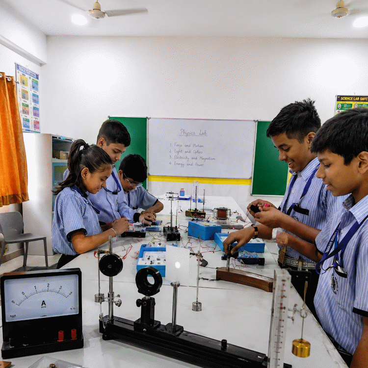 Students working with science apparatus in the school physics, chemistry and biology lab
